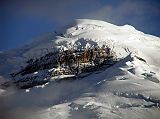 Ecuador Cotopaxi 01-07 Cotopaxi And Yanasacha Rocks At Sunset From North Here is a close up of Cotopaxis north face seen from Tambopaxi near sunset. The enormous black rock amidst the white snow is called, 